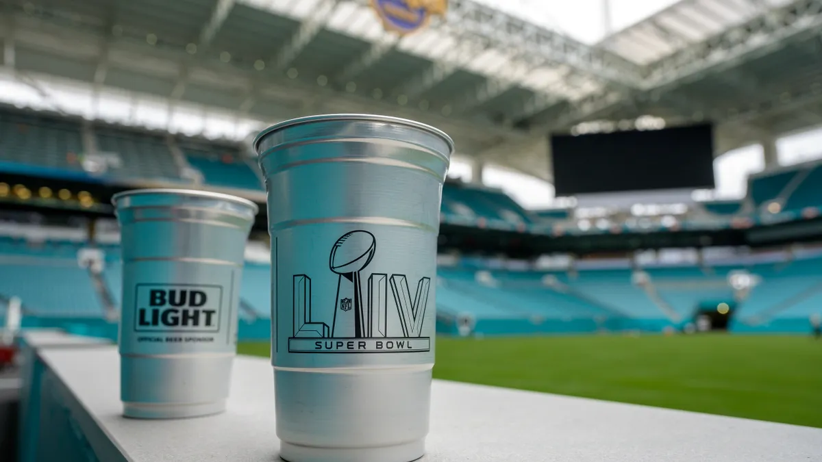 2 Ball aluminum cups branded for Bud Light and Super Bowl LIV against the backdrop of Hard Rock Stadium