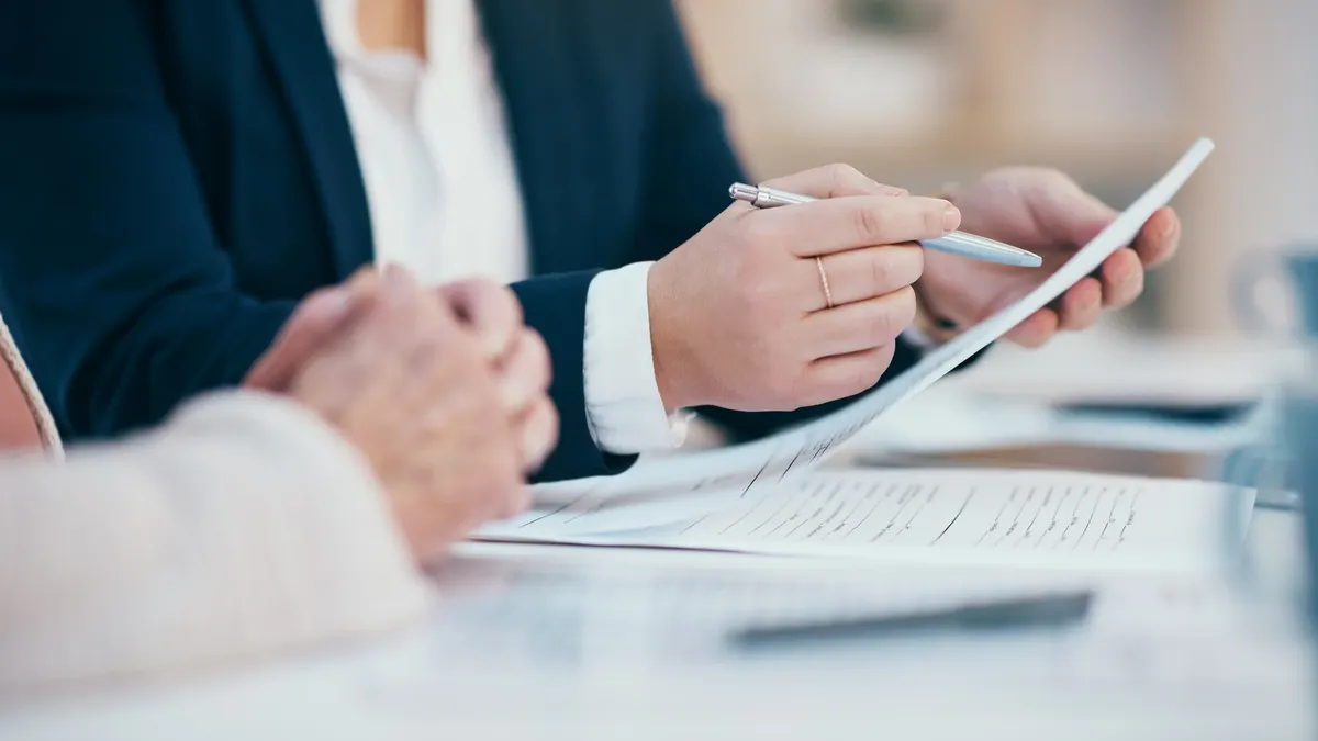 business people reviewing paper work