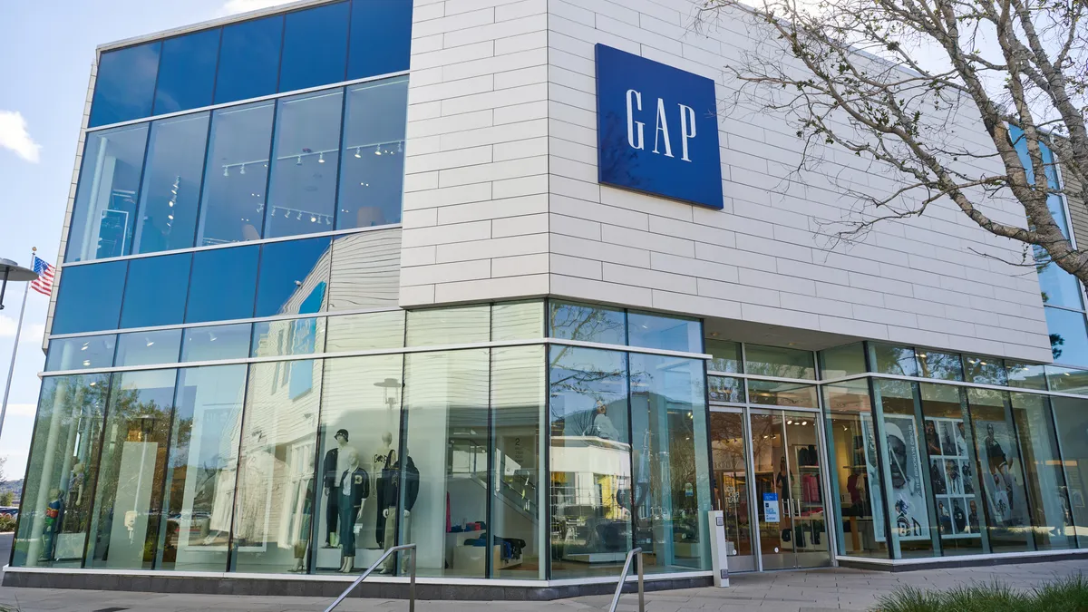 A two-story Gap clothing store, with a GAP sign in white letters on a blue square.