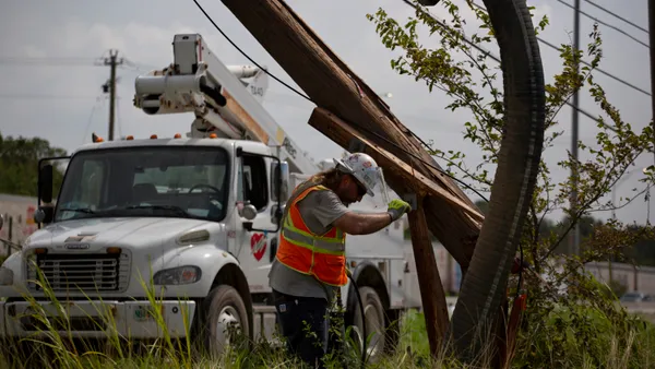 Mutual assistance crews working with CenterPoint Energy work to restore power around Houston, Texas, following Hurricane Beryl.