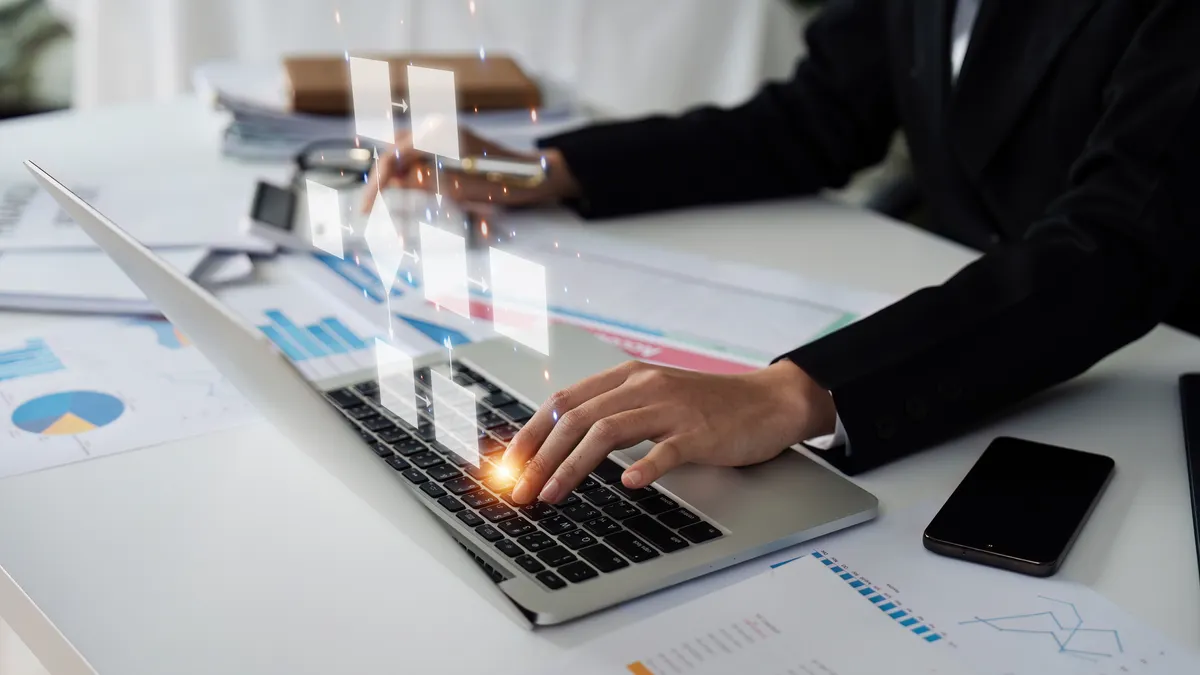 Business person using a computer analysis for process and workflow automation