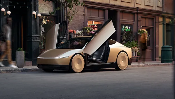 A rendering of a gold Tesla Cybercab with its doors open while parked on an urban street.