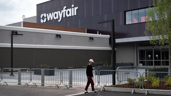 A person walks past a Wayfair store.