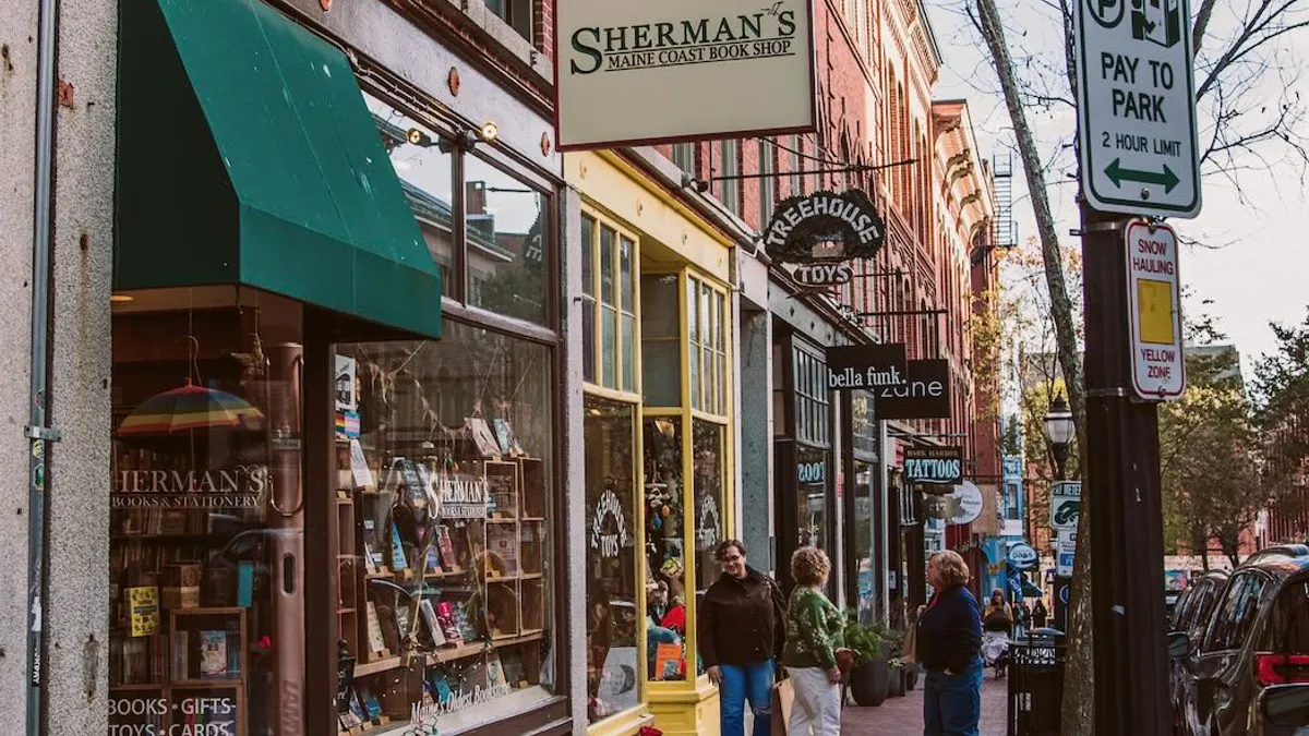 People shopping on a downtown street.
