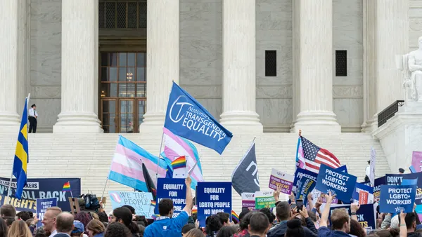 Individuals gather outside the U.S. Supreme Court.