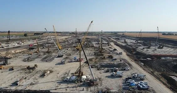 Crews drill piers and install storm drain culverts at Samsung's upcoming Taylor, Texas semiconductor site.