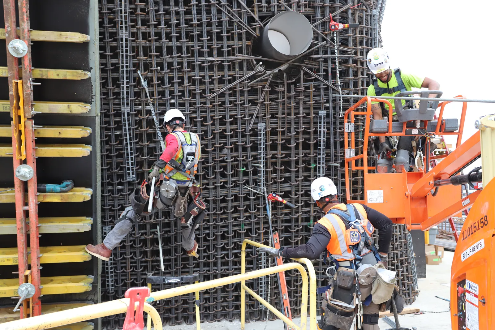 Workers place rebar ties for the main tank of the Ocean Pavilion at Seattle Aquarium.