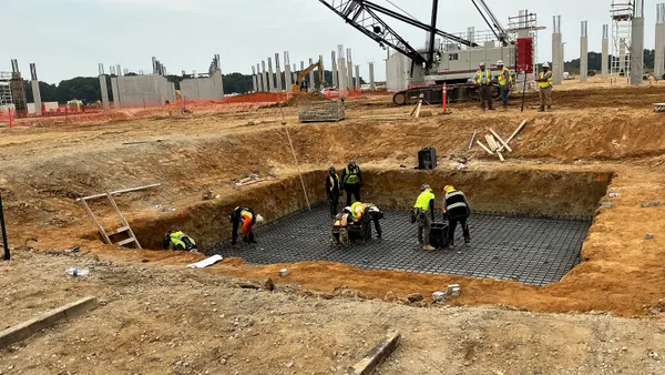 Construction workers prepare the site of the UM Shore Medical Center