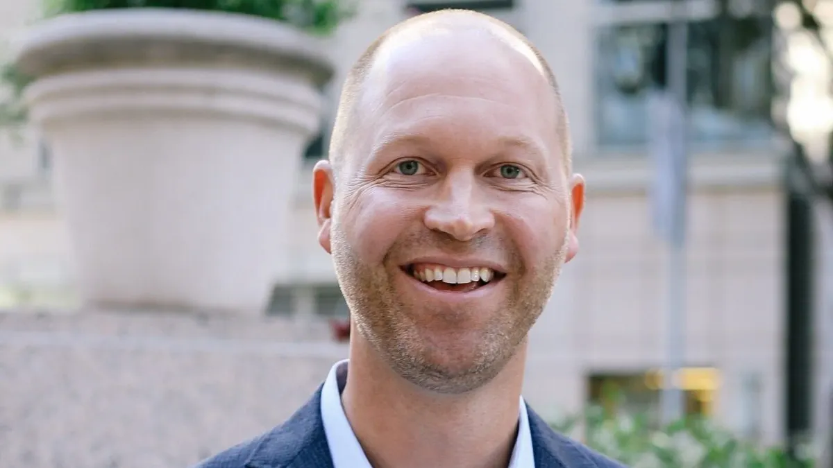 A headshot of Kirk Pederson.