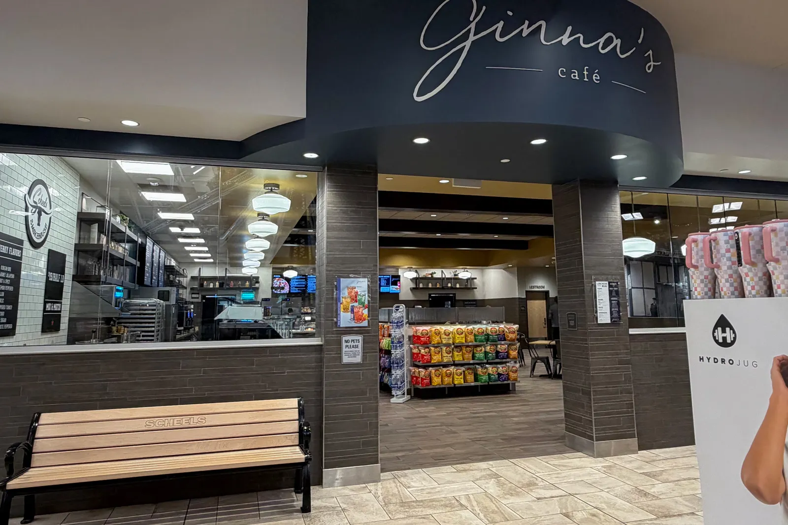 A cafe displaying snacks and other items inside a Scheels store.