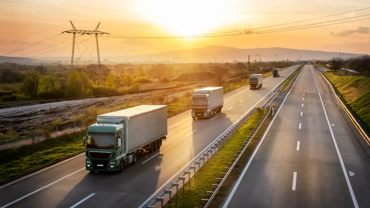 Trucks delivering cargo on an open road