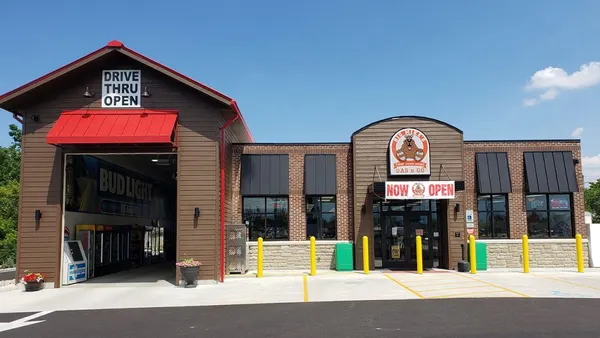 A photo of the exterior of a gas station and convenience store.