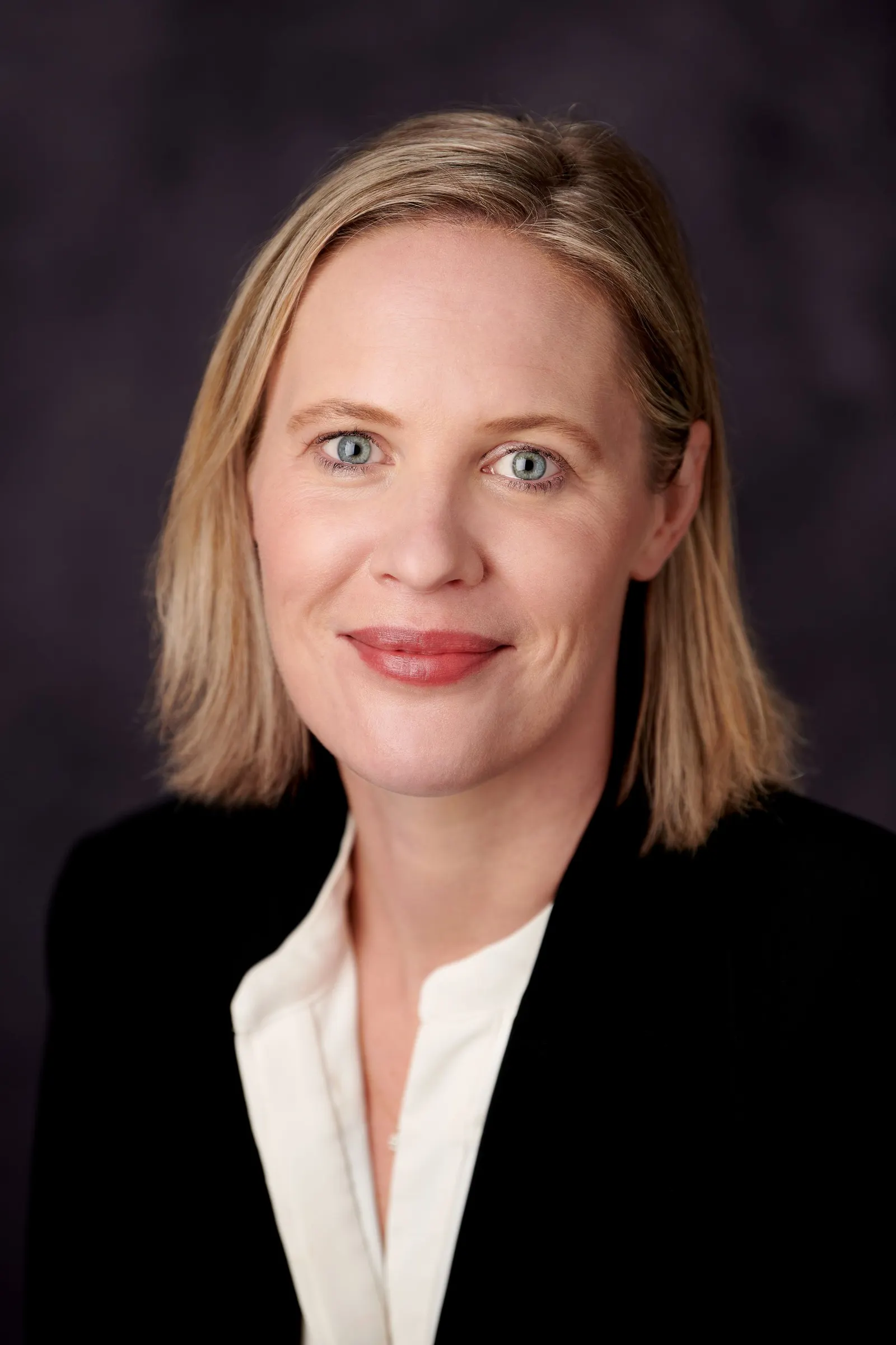 A professional headshot.