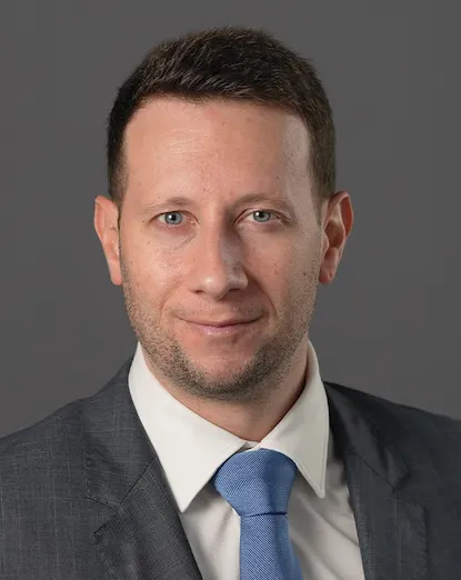 Adam Richards as a construction attorney at Dickinson Wright.