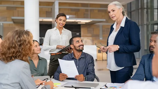 Multiethnic business team in meeting at modern board room