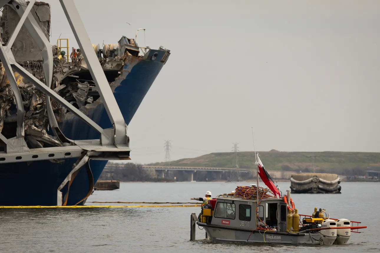 Debris is cleared from the collapsed Francis Scott Key Bridge.