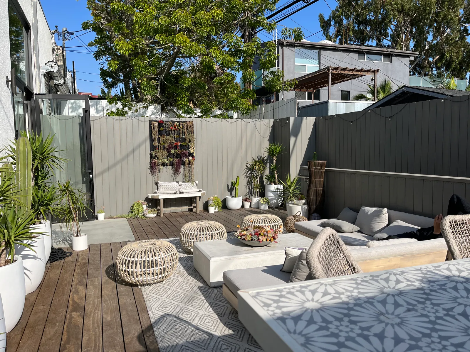 An outside space with seating at the back of a Vuori store.