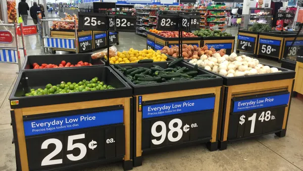 Signage showcasing low prices of produce at a store.