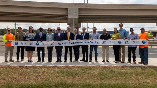 Project stakeholders celebreate the opening of the Oak Hill Parkway