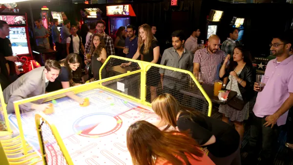 Guests play arcade games at Dave & Buster's.