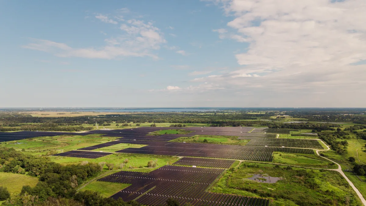 Aerial Views of Solar Panels in a Large Field in the Outskirts of Tampa, FL.