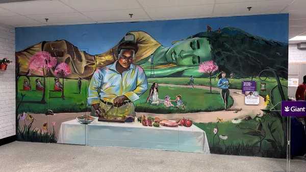 Mural at a Giant Food in Washington DC depicting Mother Nature and a community members eating, cooking and exercising