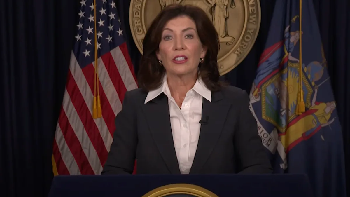 New York Gov. Kathy Hochul at a podium.