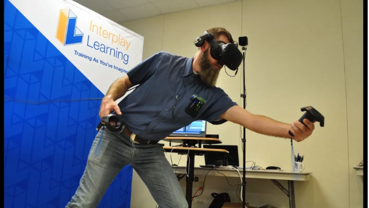 A virtual reality simulation unfolds at an interactive roadshow.