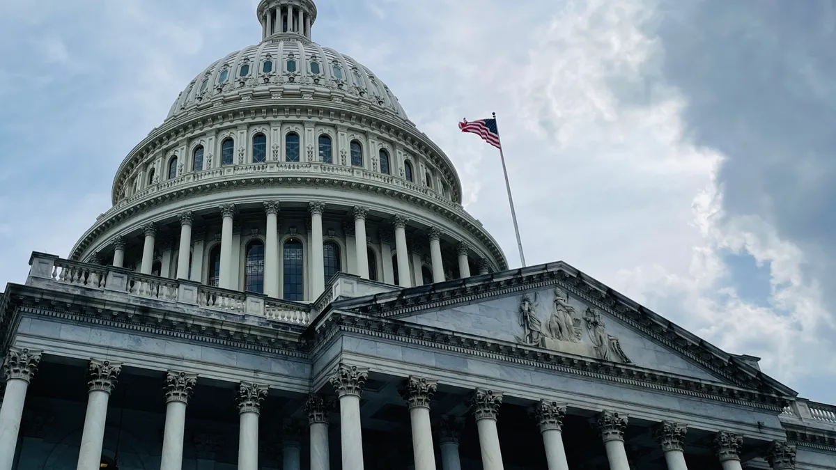 U.S. Capitol with grey sky in the background.