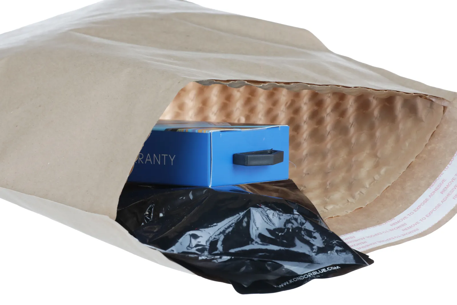 A closeup of a fiber mailer with embossed bubbles on the interior surface and products inside.