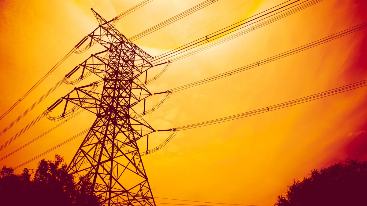 high voltage electric post in red sunset sky