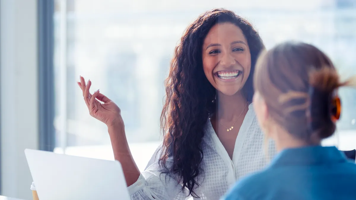 Female colleagues conversing