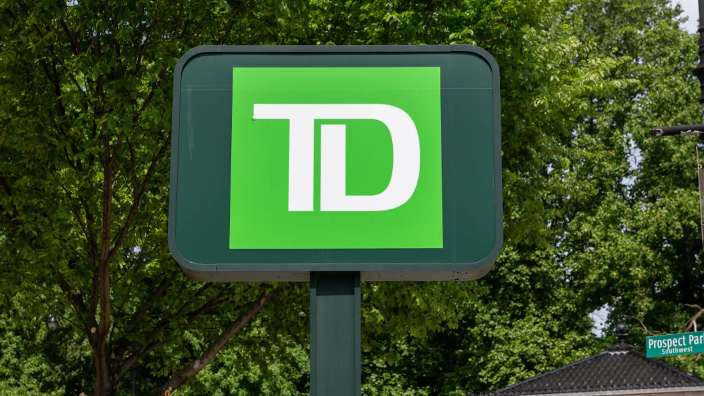 A green sign reads "TD" in white letters.