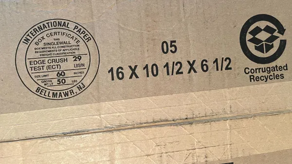 A closeup of the bottom of a corrugated box with International Paper's