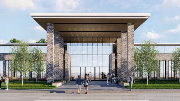 A rendering of the exterior of a building with glass facades and brick columns.