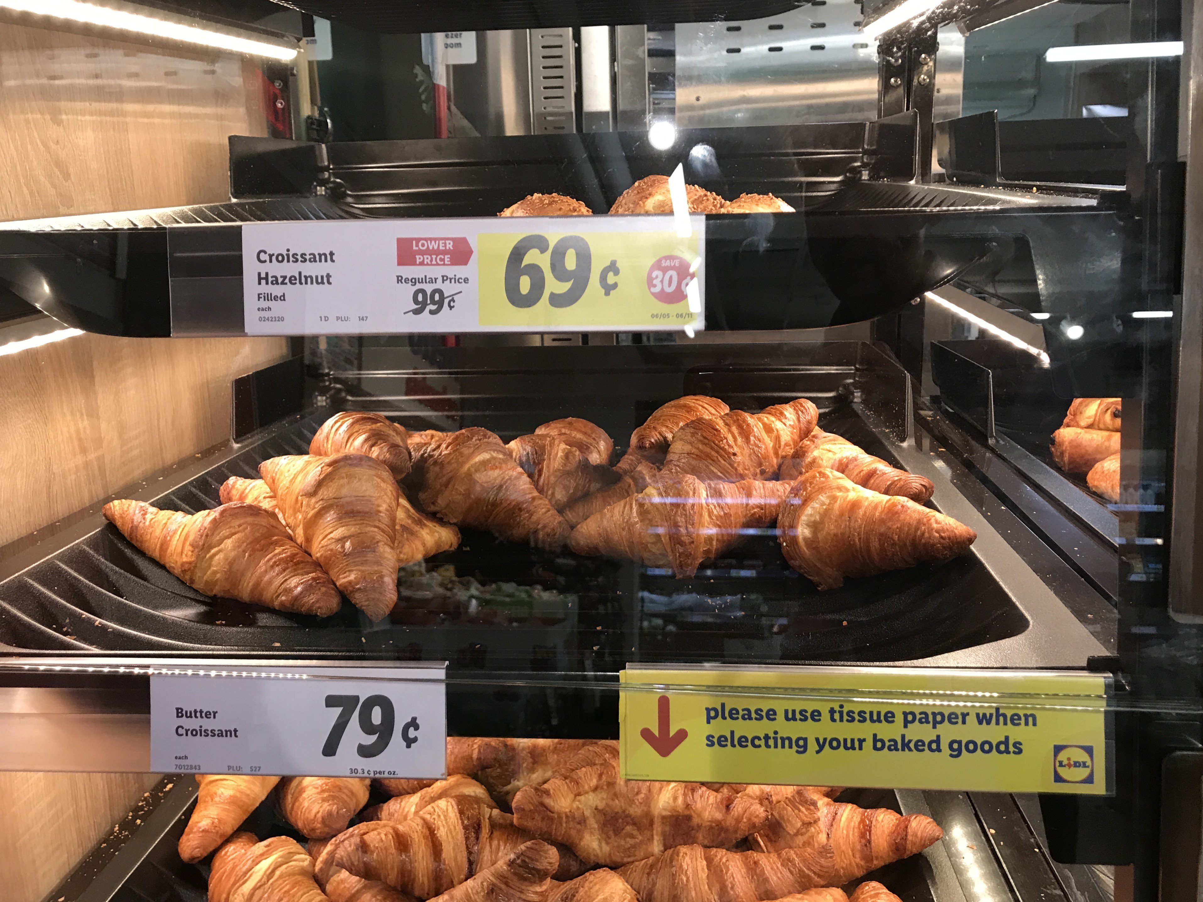 Croissants on display in a grocery store
