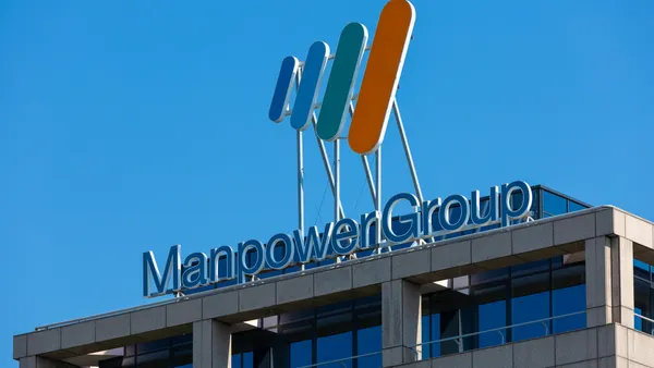 Manpowergroup office roof sign logo. Dutch headquarters of multinational staffing firm Manpower Group in Diemen.