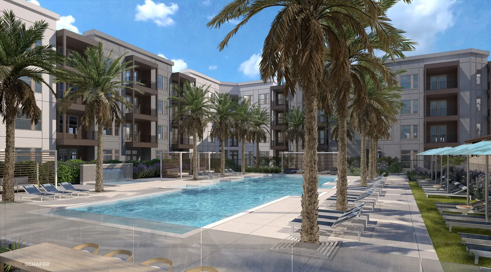 Pool with apartments in the background.