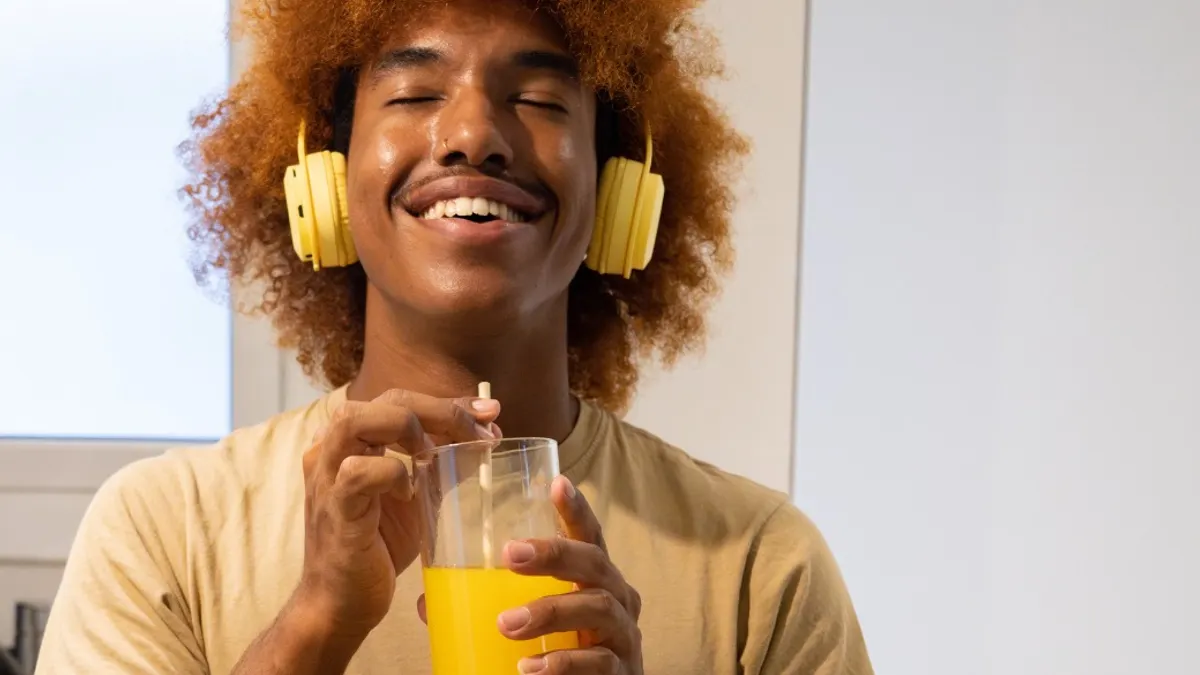 Man with beverage enjoying beverage