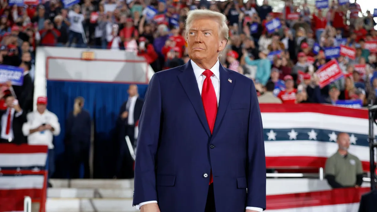 President Donald Trump takes the stage during a campaign rally at the J.S. Dorton Arena on November 04, 2024 in Raleigh, North Carolina.