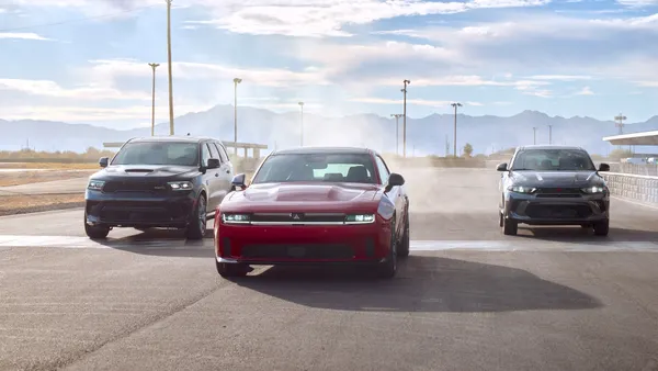 Sporty versions of the Dodge Durango, Dodge Charger, and Dodge Hornet together on the track