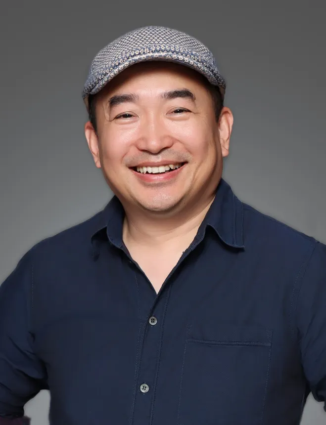 Headshot of a man in professional attire.