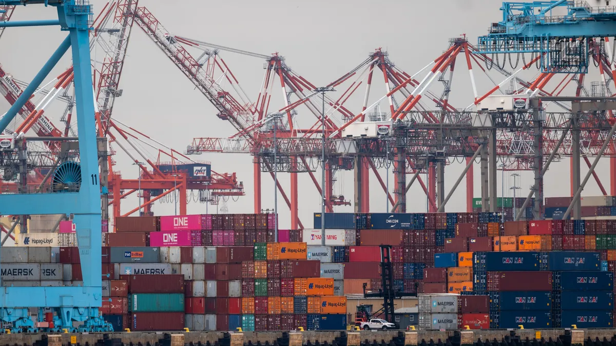 Cranes stand over shipping containers at the Port of Newark.