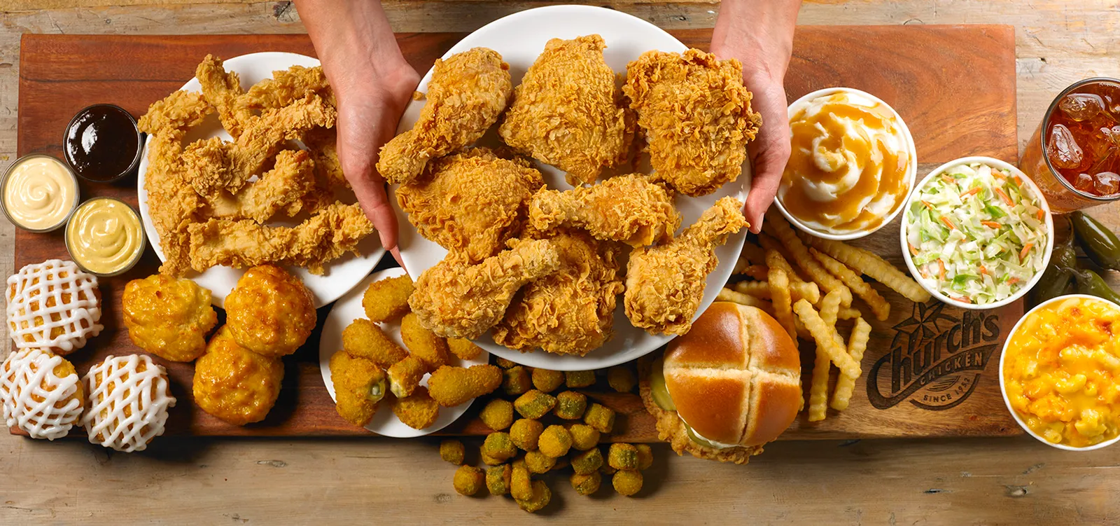 An overhead view of fried chicken and sides.