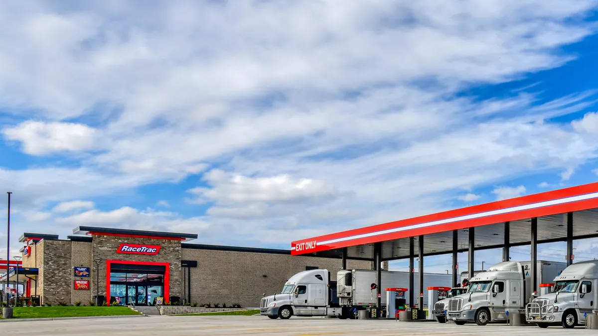 A photo of semi trucks fueling at a RaceTrac location.