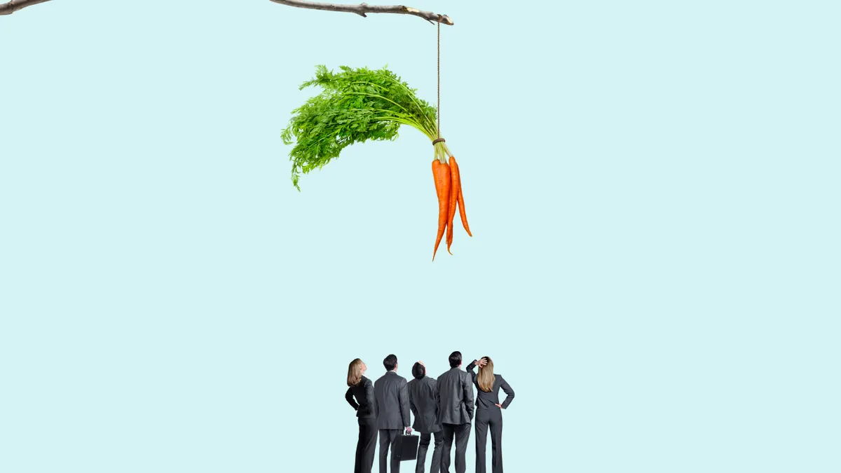 Group Of Business People Looking Up At Carrot Dangling From A Stick