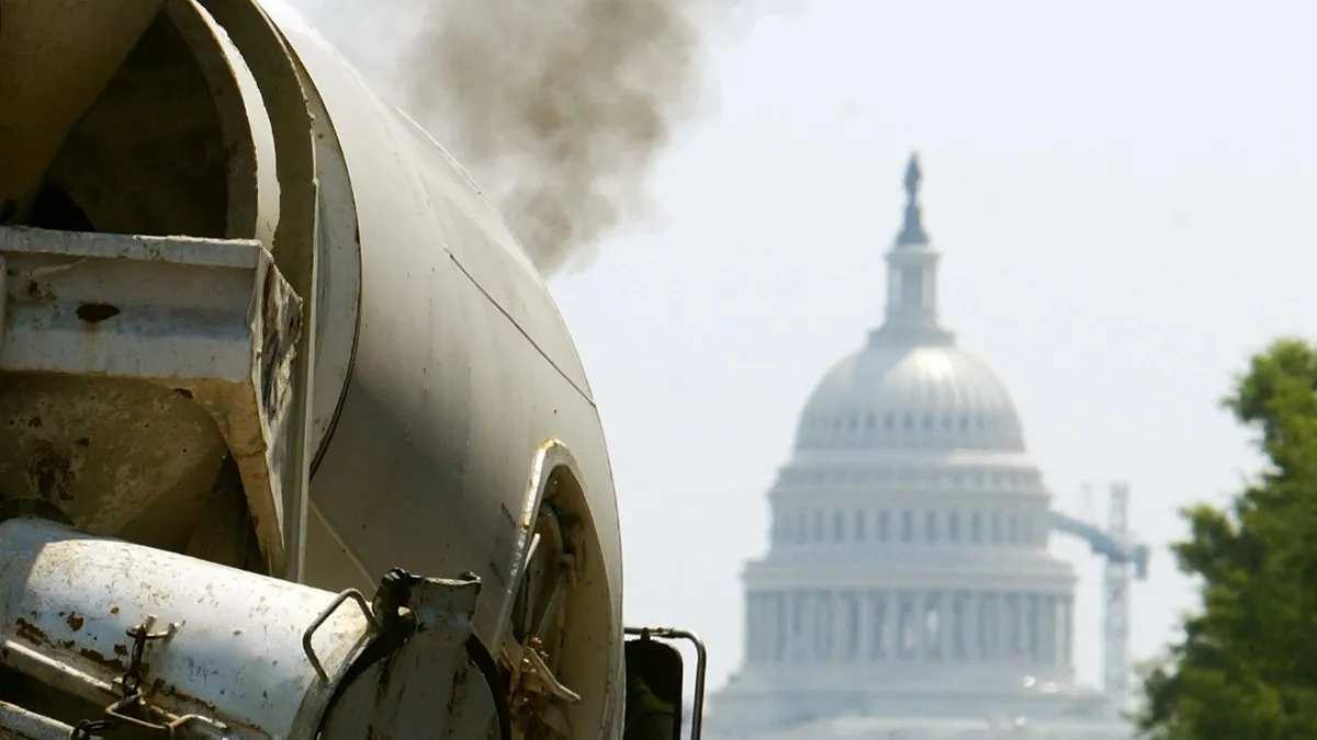 Smoke pours from the exhaust pipe of a truck in Washington, D.C.