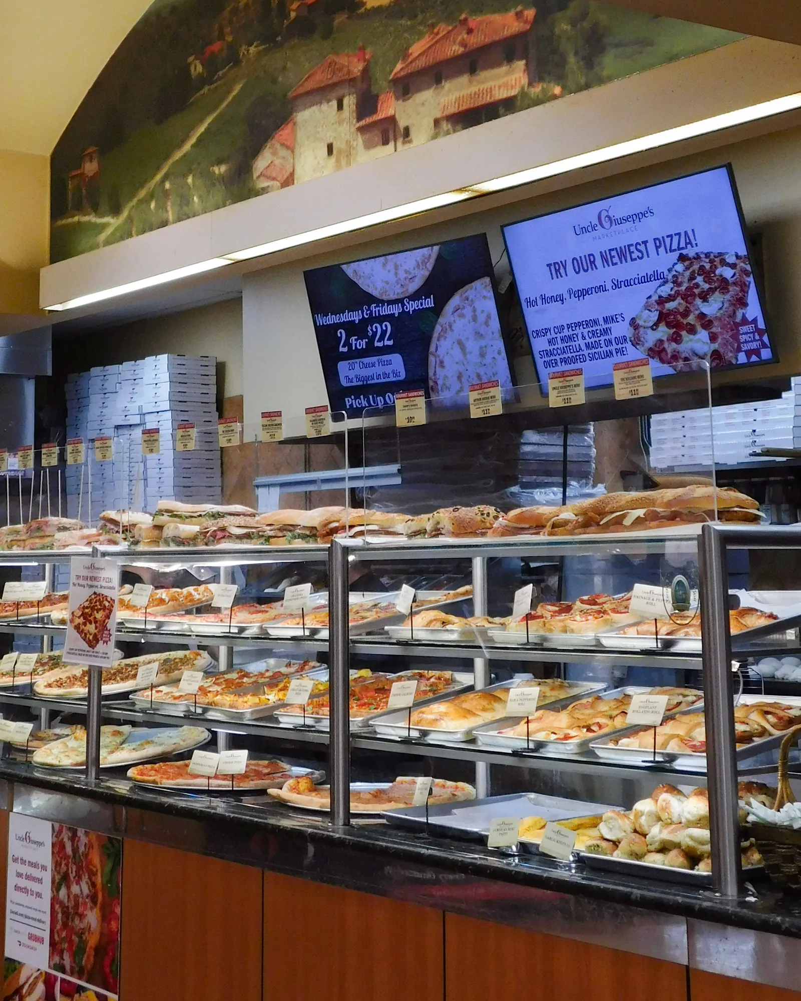 Pizza counter inside a grocery store.