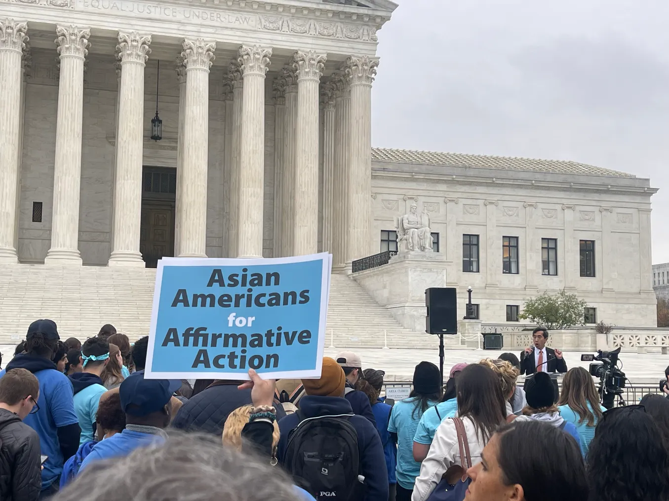 Protesters gather outside of the U.S. Supreme Court building to urge justices to preserve race-conscious admissions.