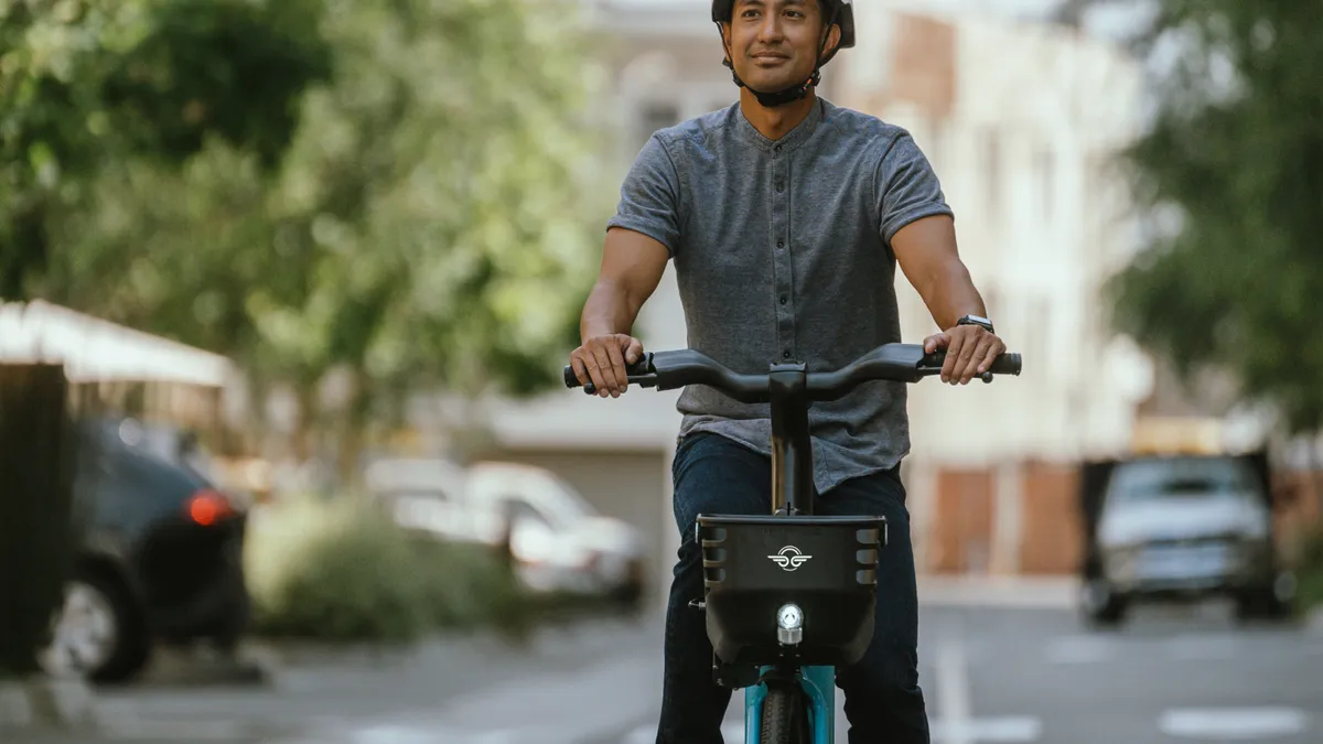 A person riding a shared bike.